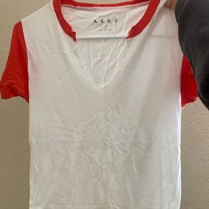 red and white v neck shirt
